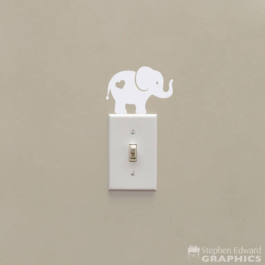 Elephant decal with heart on its butt.